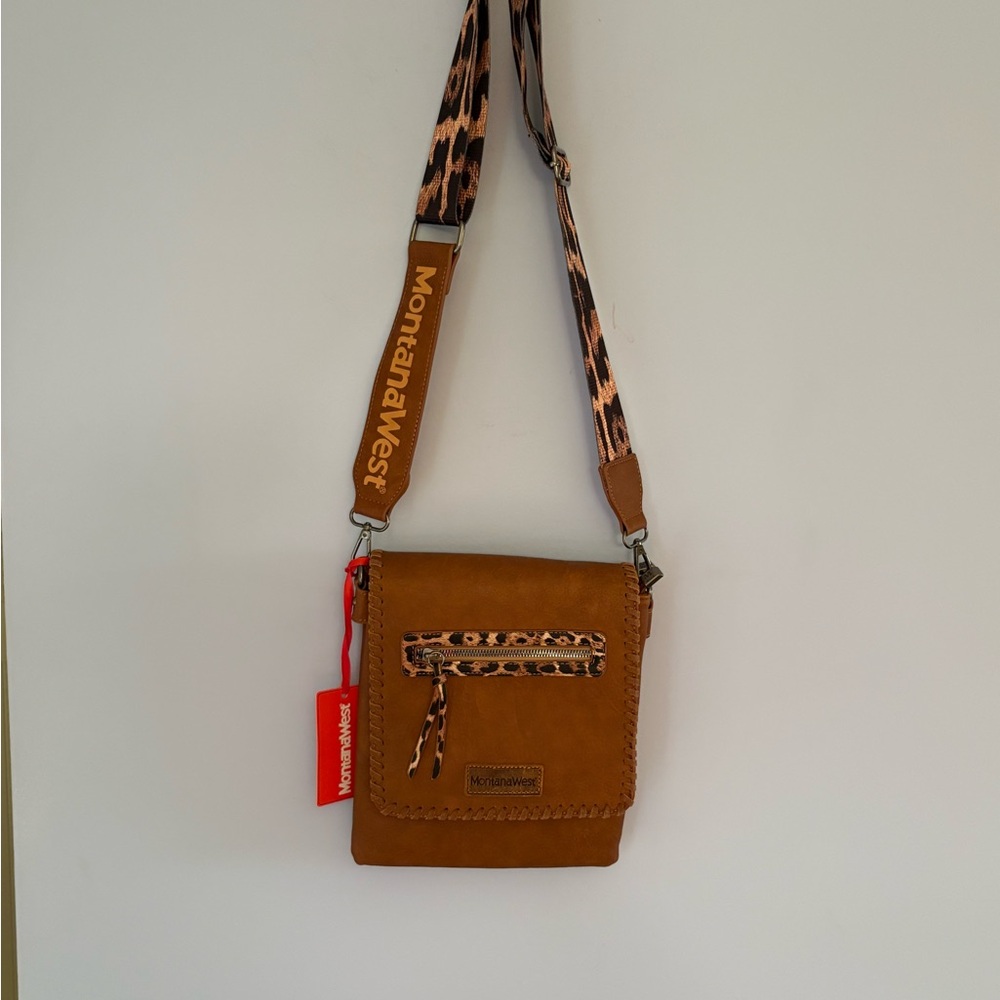 Montana West Brown Leather Strap Pocketbook. The pocketbook is 34” long & 9”wide